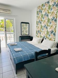 Postel nebo postele na pokoji v ubytování Cost Mari Almyrida New by ZAGO Boutiqe hotels