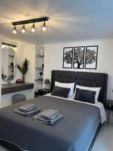 Giường trong phòng chung tại Riviera-MelRod-Athens