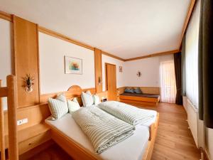 a bedroom with a large bed in a room at Apartmenthaus Brigitte in Leutasch