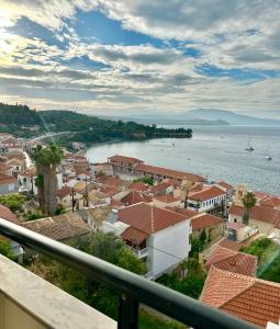 a view of a town next to the water at Balcony of Koroni in Koroni