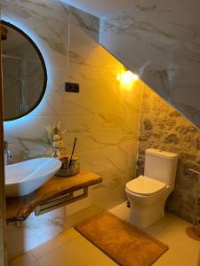 a bathroom with a sink and a toilet at Emily's House in Castro Daire +46 photos