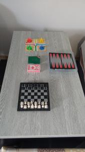 a table with a chess board on top of it at apartman Dragic in Budva