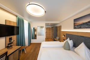 TV a/nebo společenská místnost v ubytování Design Hotel Frauenschuh