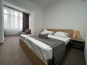 Voodi või voodid majutusasutuse Hotel Arami by Downtown toas