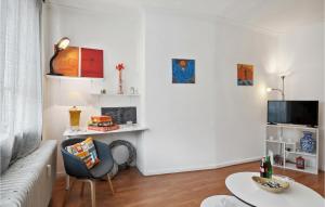 a living room with a couch and a table at 1 Bedroom Cozy Apartment In Valby in Copenhagen