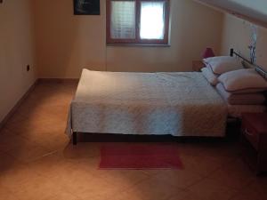 Postel nebo postele na pokoji v ubytování Apartment AnaLaura