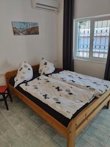 En eller flere senge i et værelse på Tourist Paradis Costinesti