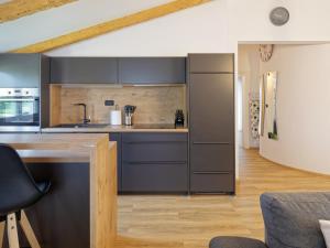 a kitchen with gray cabinets and a counter top at Villa Morgan by Rent Istria in Umag