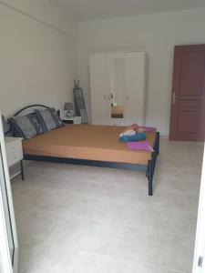 Postel nebo postele na pokoji v ubytování Konstantinos Apartmend Chalkidiki