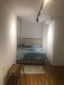 a bedroom with a bed and a table in it at Furnished Apartment for rent in Istanbul