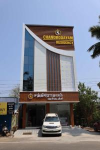 a car parked in front of a building at CHANDRODAYAM RESIDENCY in Karaikal