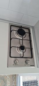 a stove top in a kitchen with a ceiling at Apartmani Centar Seline Paklenica in Seline +51 photos