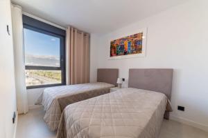 Giường trong phòng chung tại Apartamento Nuevo Alexia 1 4 1 en Calpe