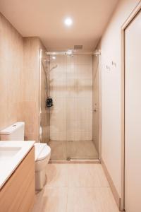 a bathroom with a toilet and a shower stall at PoolGymconference Room Executive living Great Location in Melbourne