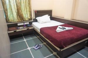 Katil atau katil-katil dalam bilik di Hotel Gujrat