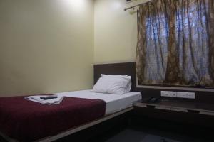 Katil atau katil-katil dalam bilik di Hotel Gujrat