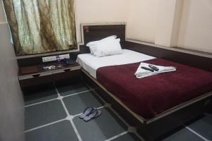 Katil atau katil-katil dalam bilik di Hotel Gujrat