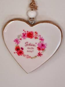 a heart shaped heart ornament with flowers on it at Ferienhaus Ritzmais in Bischofsmais