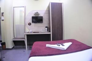 Katil atau katil-katil dalam bilik di Hotel Gujrat