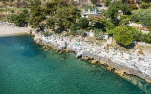 an aerial view of a body of water with a beach at Petra Mare Apartments in Alyki
