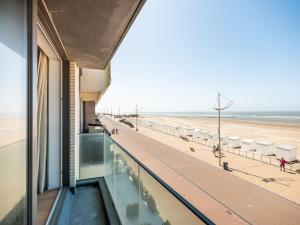 a building with a view of the beach at Zilverzand 202 new construction located on the beach in Koksijde