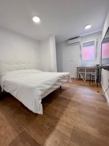 Ένα ή περισσότερα κρεβάτια σε δωμάτιο στο Hostel Sacromonte