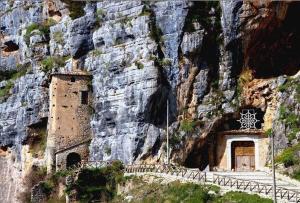 a building built into the side of a mountain at Agriturismo CuoreLieto del Cilento in Corleto Monforte