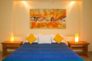 Postel nebo postele na pokoji v ubytování Tripui Hotel