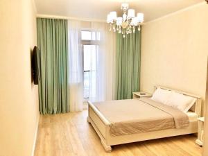 Posteľ alebo postele v izbe v ubytovaní Arcadia 2nd Pearl Apartment
