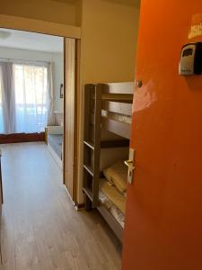 a room with two bunk beds in a room at Combettes Studio Apartment in Les Contamines-Montjoie