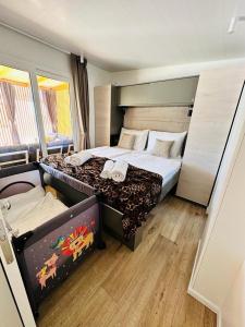 a hotel room with two beds in a room at Brand New Mobile House - Soline Beach in Biograd na Moru