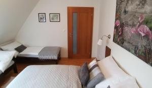 Posteľ alebo postele v izbe v ubytovaní Apartmán AURIS