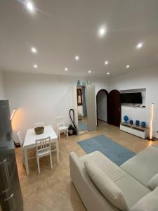 a living room with a couch and a table at Marechiaro Apartments in Palermo