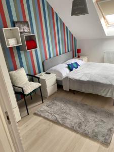 Posteľ alebo postele v izbe v ubytovaní Szőlőskert Apartman 8 fős