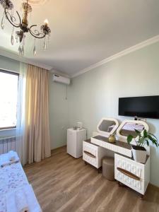 TV a/nebo společenská místnost v ubytování Sunny Days