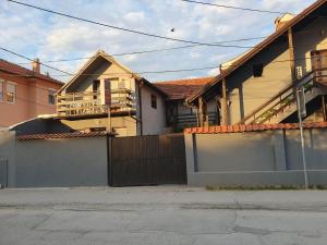 a house with a fence in front of it at Apartman Djokic 3 in Požarevac
