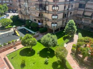 Zahrada ubytování PISO JUNTO PALACIO CONGRESOS Y METRO, CENTRICO CON PISCINA