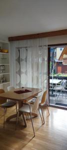 a dining room with a table and chairs at Apartma 198 in Kranjska Gora