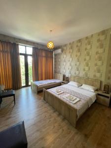 Postel nebo postele na pokoji v ubytování Hotel Traveler
