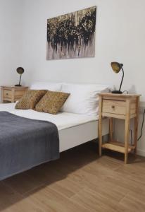a bedroom with a bed and a table with lamps at Villa Panama in Pag +38 photos