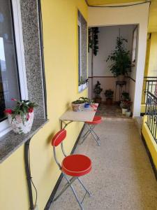 a room with two chairs and a table on a balcony at Piso con preciosas vistas de vigo in Vigo