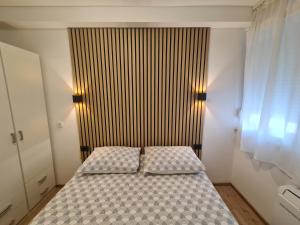 Postel nebo postele na pokoji v ubytování Apartment Skadenca