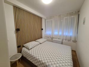 Postel nebo postele na pokoji v ubytování Apartment Skadenca