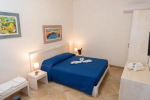 A bed or beds in a room at Agriturismo Villa Tommaso
