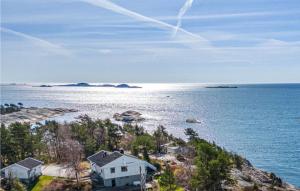 an aerial view of a house and the ocean at 4 Bedroom Pet Friendly Home In Sgne in Søgne