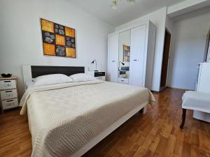 Postel nebo postele na pokoji v ubytování Apartman Kampor