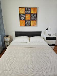 Postel nebo postele na pokoji v ubytování Apartman Kampor