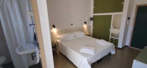 Postel nebo postele na pokoji v ubytování Hotel Internazionale