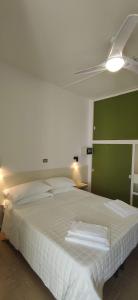 Postel nebo postele na pokoji v ubytování Hotel Internazionale