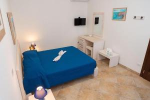 A bed or beds in a room at Agriturismo Villa Tommaso